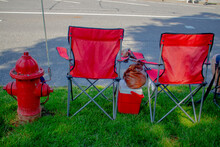 Simple Light Easy Red Folding Chairs Waiting For A Street Fair Or Street March Woman's Bag