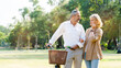 © Rapeepat - Senior Caucasian couple hugging in park. Family with a happy smile feels relaxed with nature in the morning. Or in the evening. Enter elderly society And retire from work. Concept health insurance