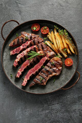 Wall Mural - Grilled steak with french fries.