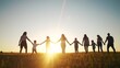 © maxximmm - community large family in the park. a large group of people holding hands walking silhouette on nature sunset in the park. big family kid dream concept. people in the park. large lifestyle family