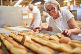 Fototapeta  - Bäckerin mit Erfahrung beim Backen von Berliner Pfannkuchen