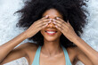 © kanpisut - Portrait of African American woman with bushy curly hairstyle