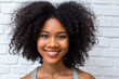© kanpisut - Portrait of African American woman with bushy curly hairstyle