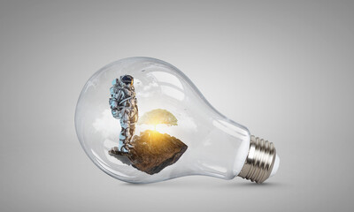 Wall Mural - spaceman inside light bulb . mixed media