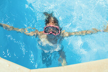 Child Swims In Pool Underwater, Happy Active Girl In Snorkel Goggles Has Fun In Water