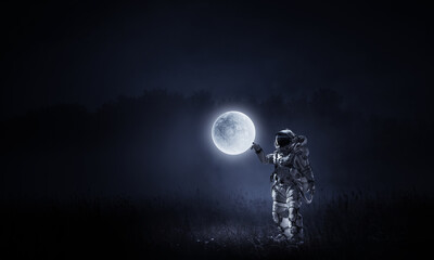 Wall Mural - astronaut walking on an unexplored planet