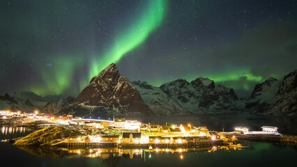 Wall Mural - Aurora borealis with starry over mountain with scandinavian village on winter