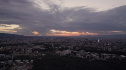 Wall Mural - Bird view over the city with twilight sunset sky