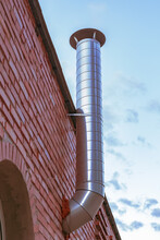 Exhaust Pipe Air Duct Ventilation On Brick Facade