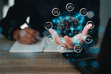 Digital transformation technology strategy,Businessman hands showing a global network of business graphics information world concept and use laptop notebook on wood table