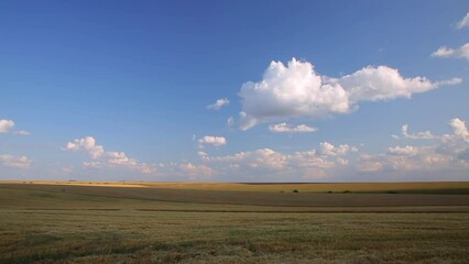 Canvas Print - Footage of a beautiful cloudy landscape in summer. Timelapse clip.