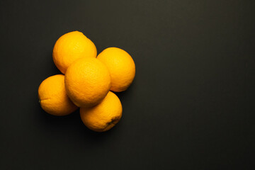 Canvas Print - Top view of natural oranges isolated on black with copy space.