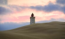View Of Rubjerg Knude Lighthouse Behind The Dunes Against Cloudy Sky At Sunset. Denmark.