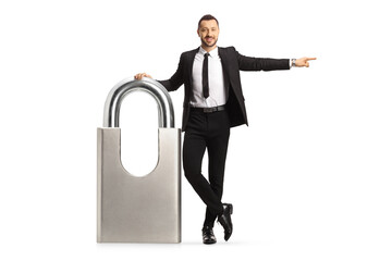 Sticker - Businessman leaning on a big padlock and pointing