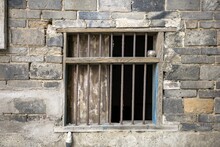 View Of An Old Jail Window Bars Of A Brick-built Building