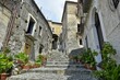 Low angle shot of a narrow street between old houses in Scalea village, the Calabria region, Italy