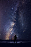 Fototapeta Kosmos - Man observing night sky in nature.
