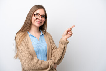 Young Lithuanian woman isolated on white background pointing finger to the side