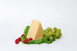 piece cheese with apples and tomatoes on a wooden board on a beautiful background