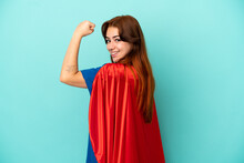 Young Caucasian Woman Isolated On White Background In Superhero Costume And Doing Strong Gesture