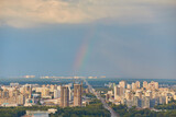 Fototapeta Tęcza - Skyline of Kyiv with Metro bridge and rainbow in the sky.