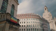 Peace And Pride Rainbow Flag In Historic Downtown Dresden With Frauenkirche Church In Background