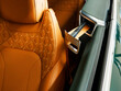 © AvokadoStudio - chic orange luxury leather in an expensive car in a coupe body