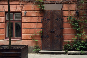 Wall Mural - View of building with vintage wooden door and window. Exterior design