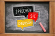 Chalkboard with text SPRECHEN SIE DEUTSCH? (DO YOU SPEAK GERMAN?)