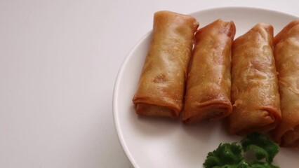 Wall Mural - Spring rolls of fried Chinese food that spins on the table