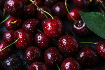 Tasty ripe cherry with water drops as background, closeup