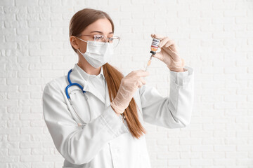 Wall Mural - Female doctor with monkeypox vaccine and syringe on white background