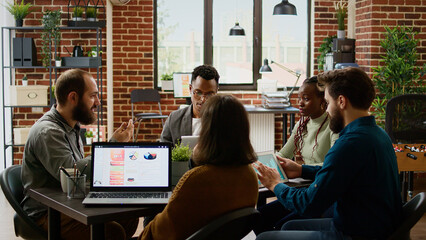 Poster - Diverse team of business people working on partnership report, analyzing charts on documents to plan presentation. Coworkers looking at management data on papers and digital tablet.