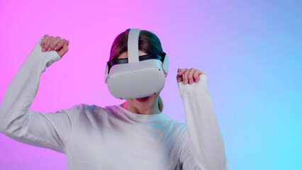 Poster - Young woman in vr headset dancing isolated over colorful background