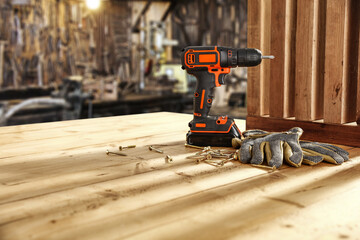 Wall Mural - Black and orange drill and wooden desk of free space 