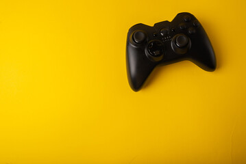 Wall Mural - Joystick, gamepad on a yellow background. Console games concept