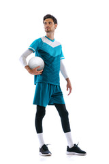 Portrait of young man, volleyball player posing in uniform isolated over white studio background