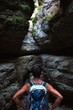 © Ольга Симонова - Tourist with a backpack in a high gorge in the mountains of Dagestan. Saltinsky canyon, waterfall. Active recreation,hiking