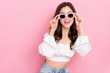 Poster - Photo of adorable attractive female in sunglass relaxing summer holidays vacation isolated on pink color background