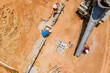 A aerial top view of workers pouring concrete columns in a new building construction