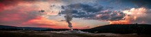 Panoramic View Of Old Faithful Geyser At Colorful Sunset In Yellowstone National Park, Wyoming