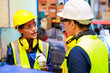 © NVB Stocker - Happy female factory manager working with asian man worker in industrial warehouse factory. Portrait Indian women worker working.