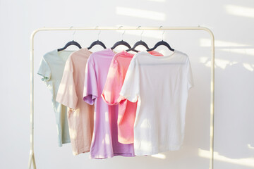 Wall Mural - women's t-shirts on  hanger on  white background