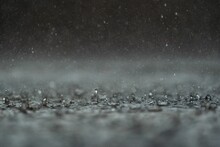 Close-up Shot Of Rain Drops On A Water Surface