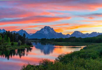 Wall Mural - landscape of snow mountain reflecting in the lake in twilight after sunset