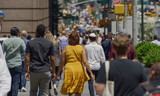 Fototapeta  - Crowd of people walking city street