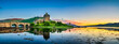 Eilean Donan Castle at sunset in Scotland.
