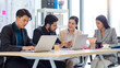 © Bangkok Click Studio - Group of millennial Asian Indian multinational multicultural male and female businessman businesswoman teamwork in formal suit sitting smiling brainstorming meeting together in office conference room