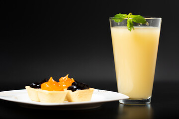 freshly squeezed cantaloupe juice, cantaloupe nut mix with cocktail and melon slice, black background and dark theme