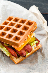 Canvas Print - Waffle waffles with grilled sausages and fresh vegetables